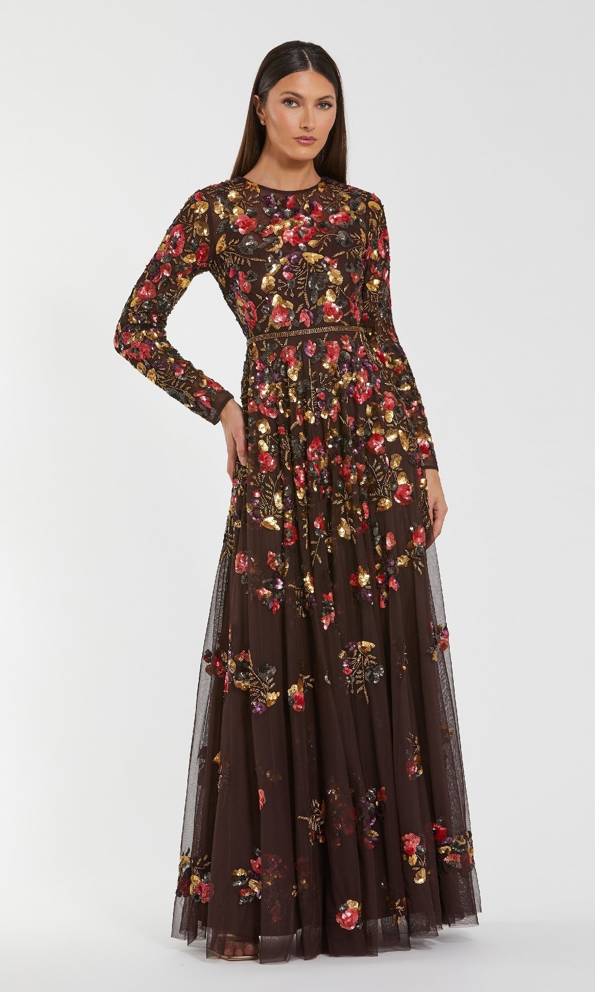 Woman wearing the Mac Duggal 94275 Long Sleeve Sequin Formal Dress in black with red and gold floral embroidery, standing against a plain white background.